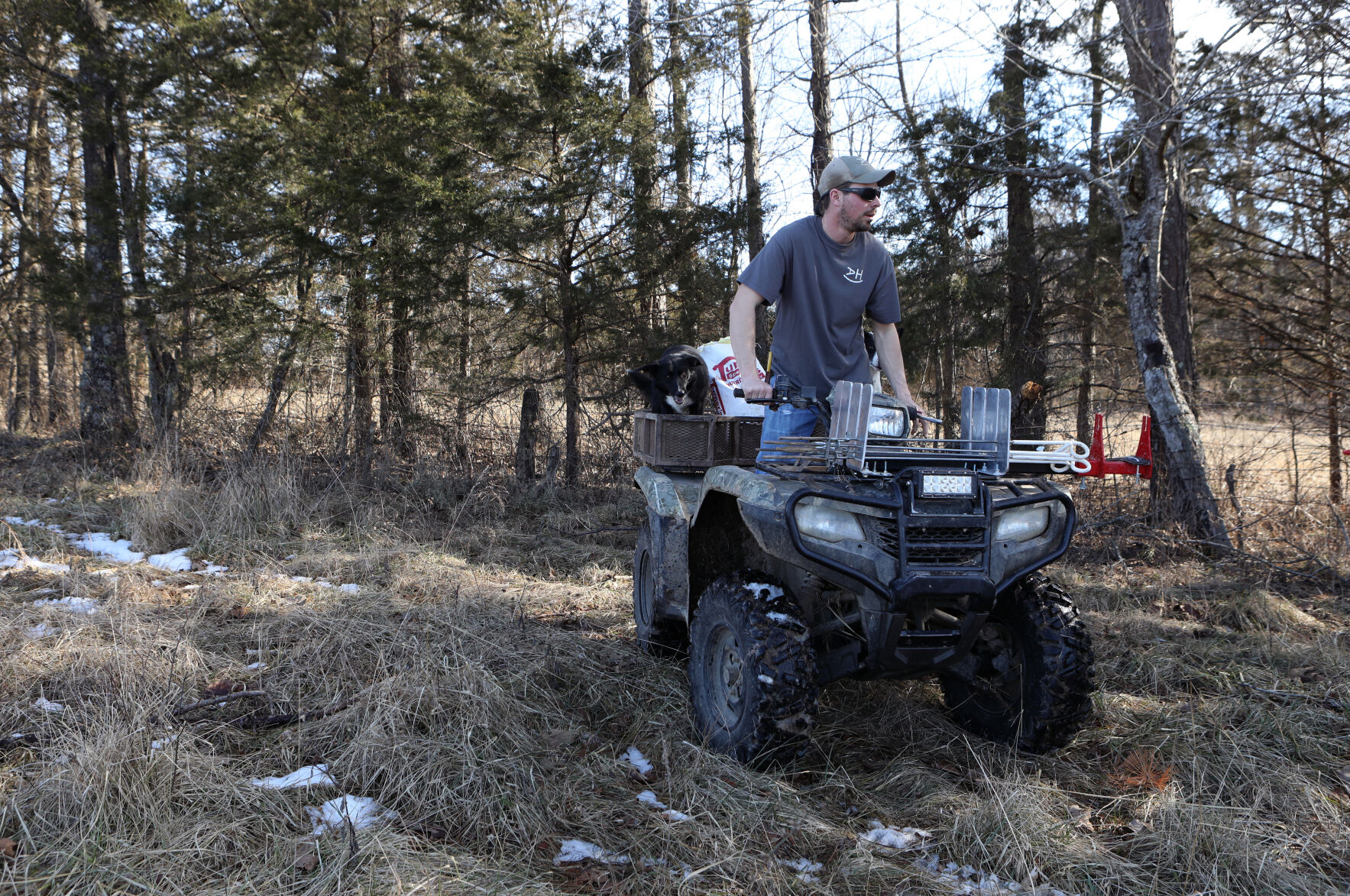 August Horstmann rests on a four-wheeler